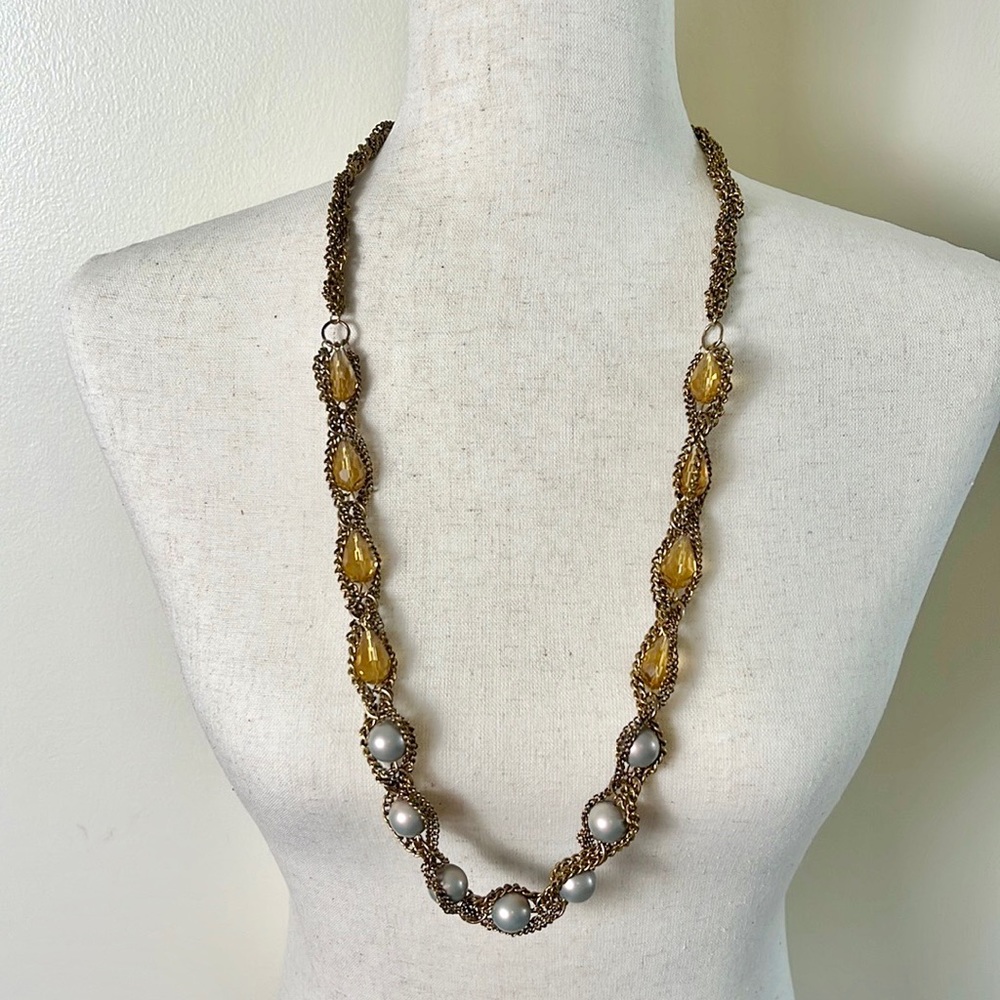 Long gold, dark yellow, and pearl necklace